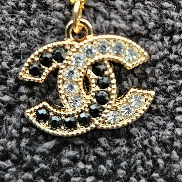 CHANEL Accessories - Elegant Black and Clear Rhinestone Charm